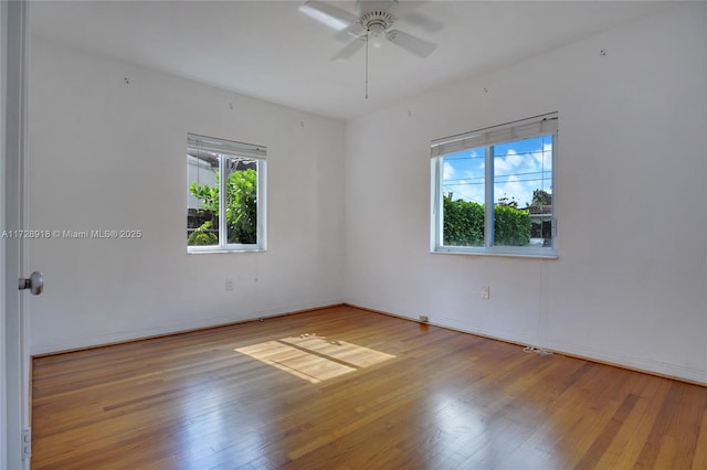 spare room featuring ceiling fan and light wood-type flooring