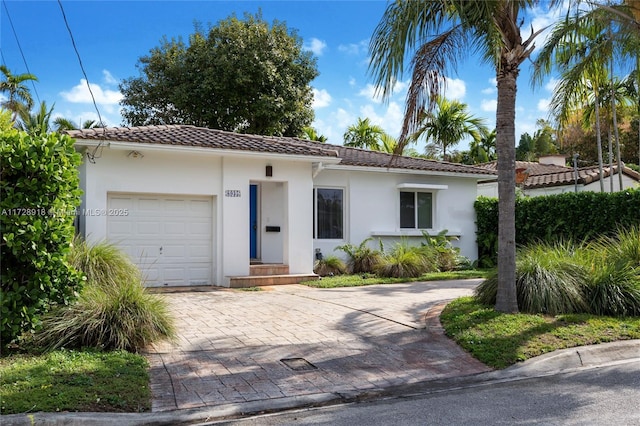 mediterranean / spanish home featuring a garage