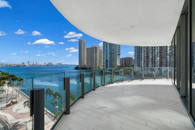 balcony featuring a water view