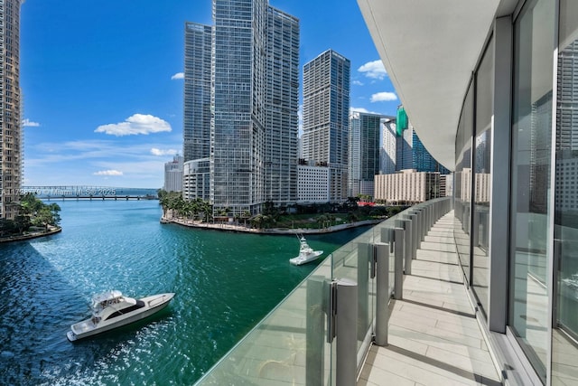 balcony with a water view and a city view