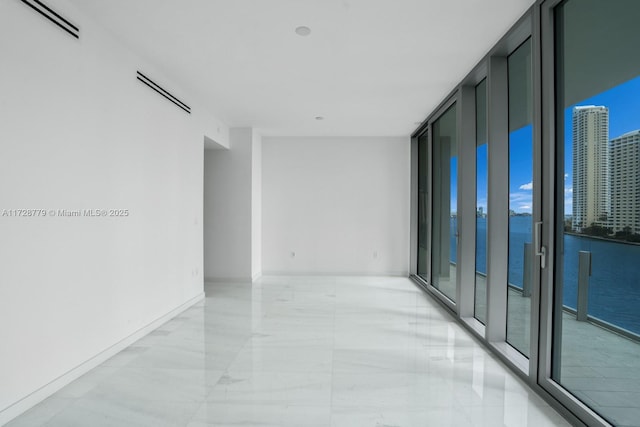 corridor with floor to ceiling windows