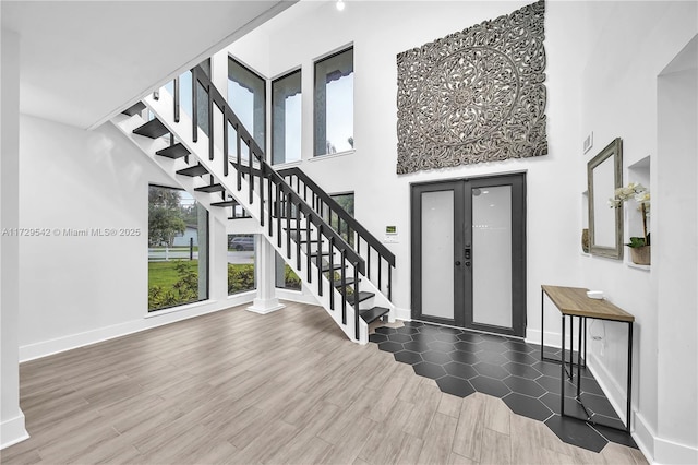 entryway featuring french doors and dark hardwood / wood-style flooring