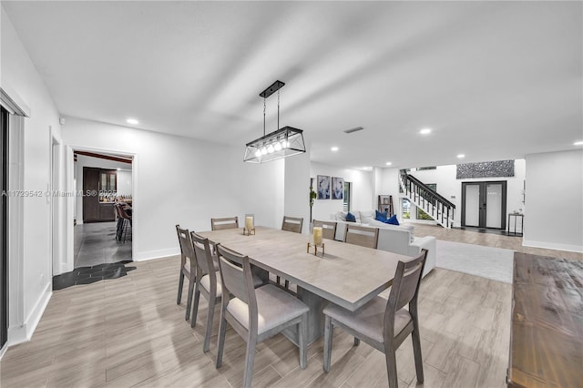 dining space with light hardwood / wood-style flooring