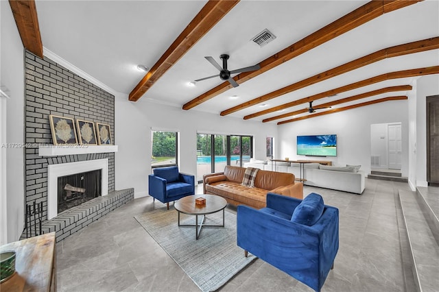 living room featuring a fireplace, lofted ceiling with beams, and ceiling fan