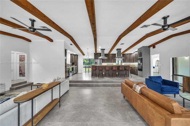 living room featuring ceiling fan and vaulted ceiling with beams