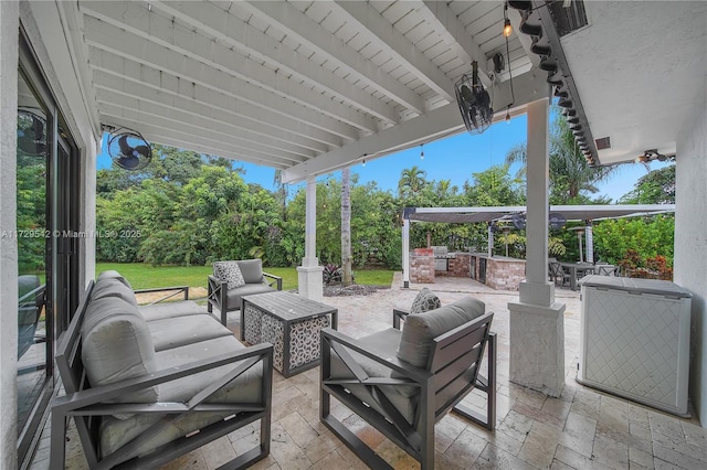 view of patio with an outdoor living space and area for grilling