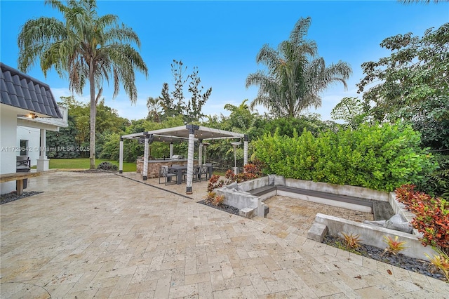 view of patio / terrace featuring an outdoor bar