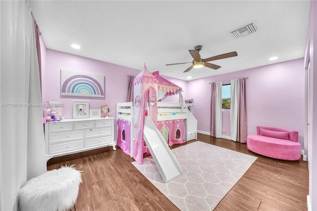 bedroom featuring ceiling fan and hardwood / wood-style flooring