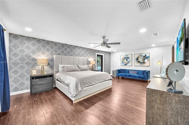 bedroom with ceiling fan and dark hardwood / wood-style flooring