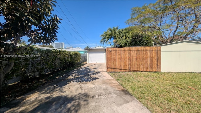 exterior space with driveway and fence