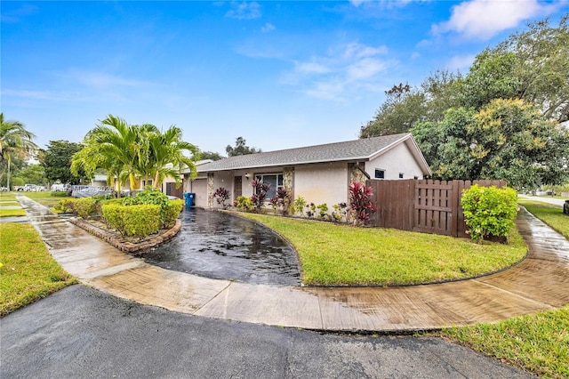 ranch-style house with a front yard