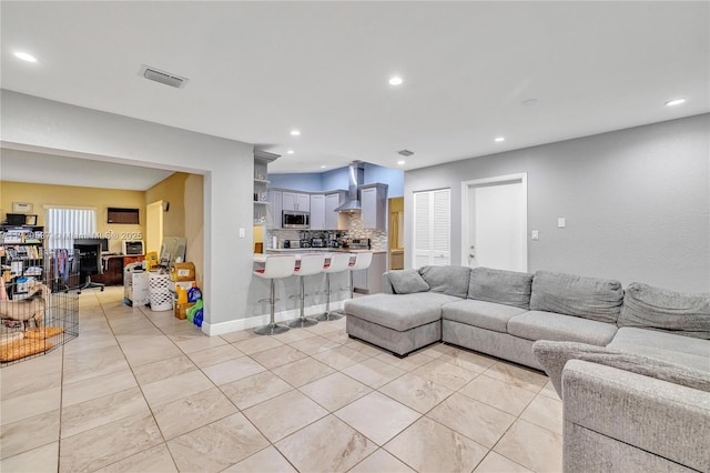 living room featuring light tile patterned floors