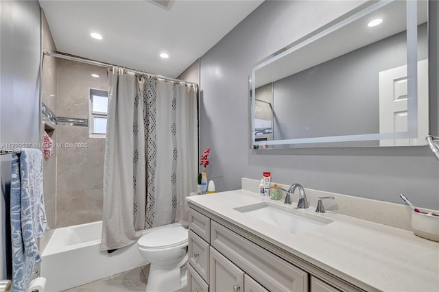 full bathroom featuring toilet, vanity, and shower / tub combo