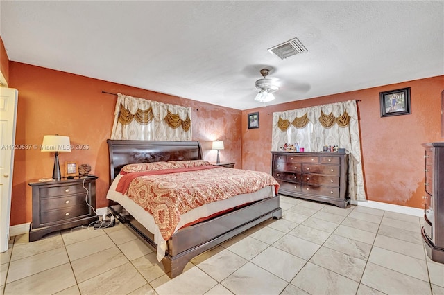 tiled bedroom with ceiling fan