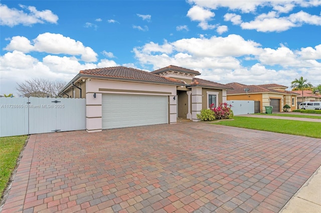 mediterranean / spanish house featuring a garage and a front lawn