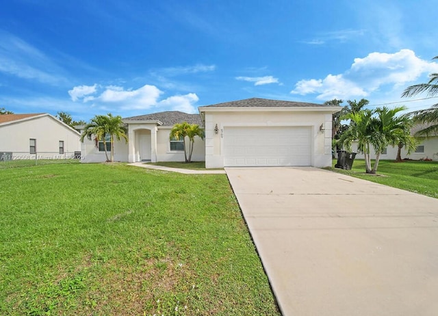 view of front of house featuring a garage and a front yard