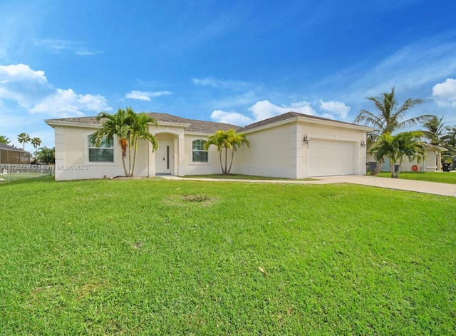 view of front of home with a front lawn and a garage