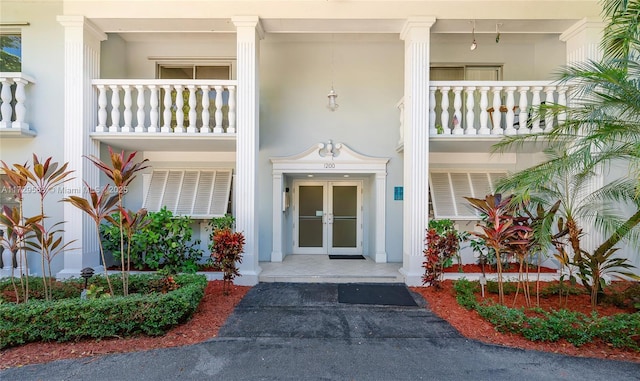 property entrance featuring french doors