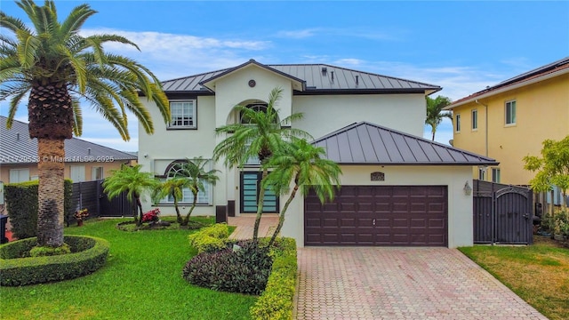 view of front facade with a garage and a front yard