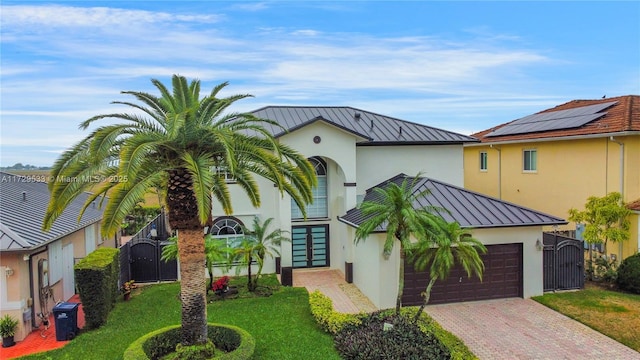 view of front of house featuring a garage and a front yard