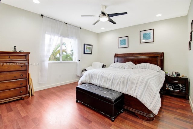 bedroom featuring ceiling fan and dark wood-type flooring