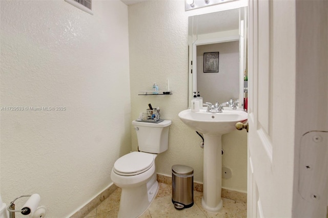 bathroom with sink, tile patterned floors, and toilet