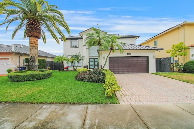 view of front facade featuring a garage and a front lawn