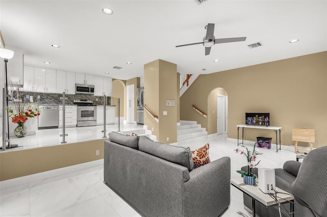 living room featuring ceiling fan