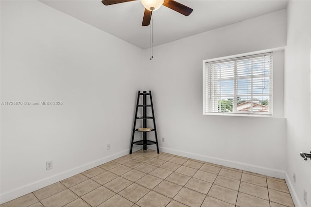 tiled empty room with ceiling fan