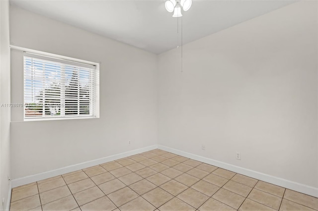 unfurnished room featuring light tile patterned flooring