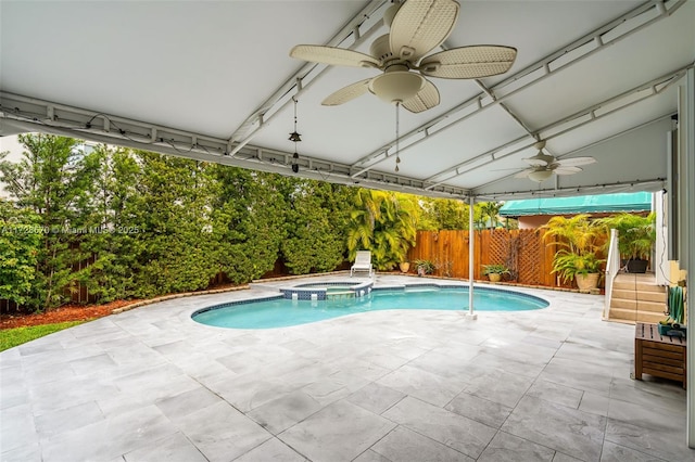 view of pool with an in ground hot tub and a patio