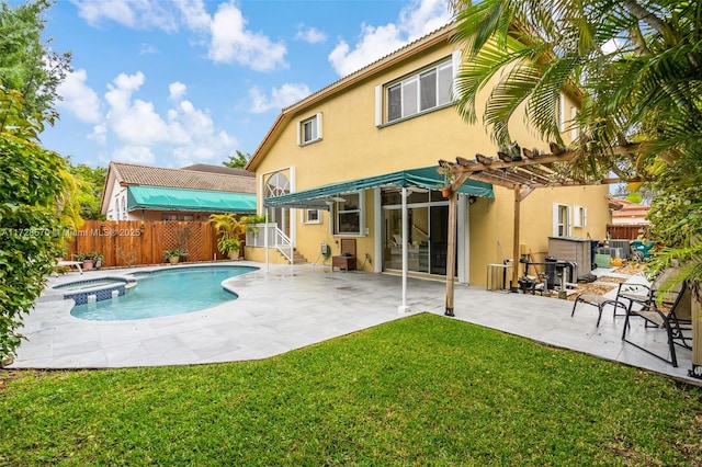 back of property featuring a pergola, a yard, a patio area, and an in ground hot tub