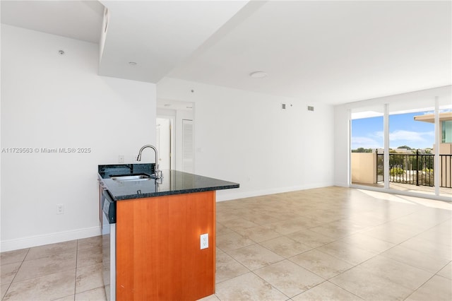 kitchen with light tile patterned flooring, dishwasher, and sink