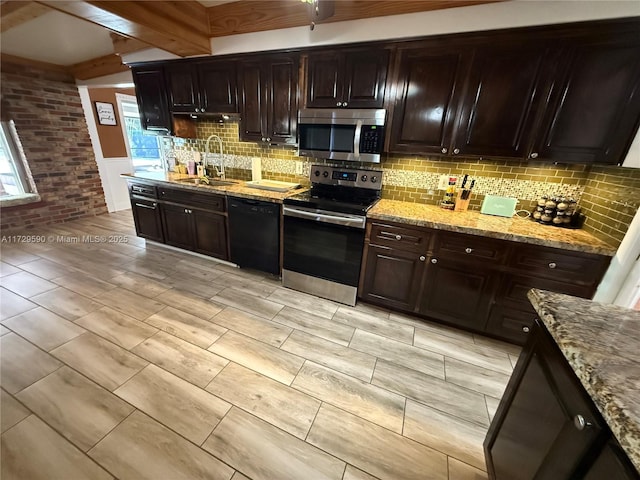 11845 SW 97th Ave, Miami, FL 33176 - kitchen with appliances with stainless steel finishes, beamed ceiling, sink, light stone counters, and dark brown cabinets