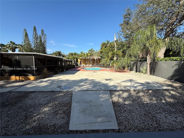 11845 SW 97th Ave, Miami, FL 33176 - view of yard featuring a fenced in pool, a patio area, and a sunroom