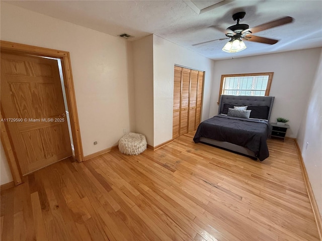 11845 SW 97th Ave, Miami, FL 33176 - bedroom featuring ceiling fan, a textured ceiling, light hardwood / wood-style flooring, and a closet