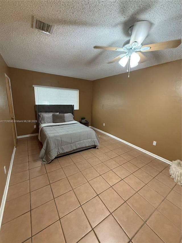11845 SW 97th Ave, Miami, FL 33176 - bedroom with ceiling fan, a textured ceiling, and light tile patterned floors