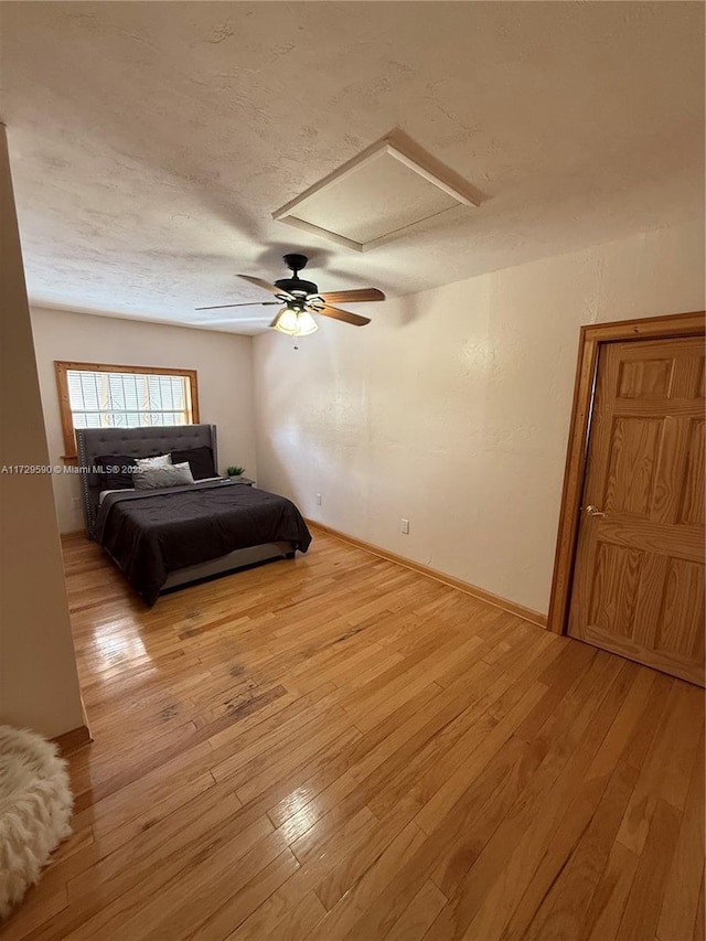 11845 SW 97th Ave, Miami, FL 33176 - bedroom with a textured ceiling, ceiling fan, and light hardwood / wood-style flooring