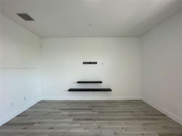 empty room with light hardwood / wood-style floors