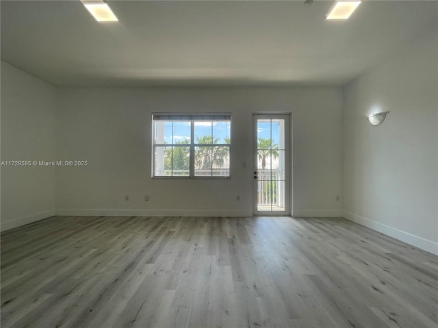 unfurnished room featuring light wood-type flooring