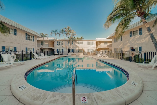 view of swimming pool with a patio