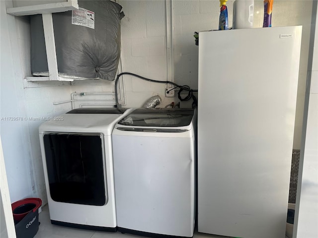 laundry area featuring washing machine and clothes dryer