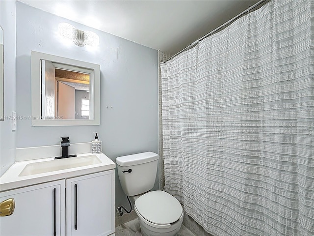 full bathroom with toilet and vanity