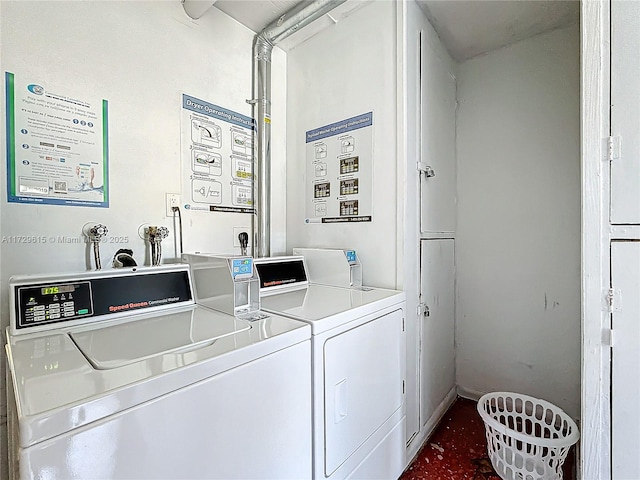 common laundry area featuring washing machine and clothes dryer