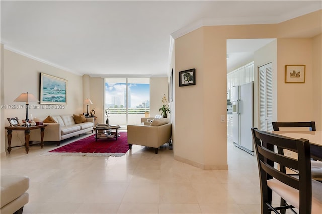 living room featuring expansive windows, light tile patterned floors, and ornamental molding