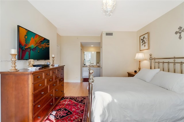 bedroom with hardwood / wood-style flooring