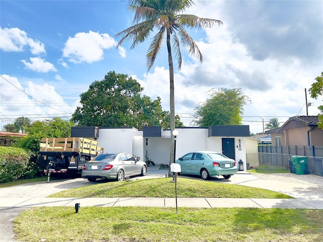 view of car parking with a yard