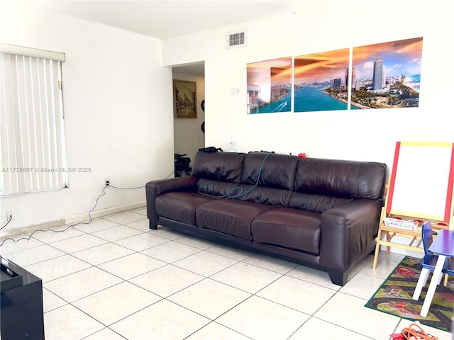 living room with tile patterned floors