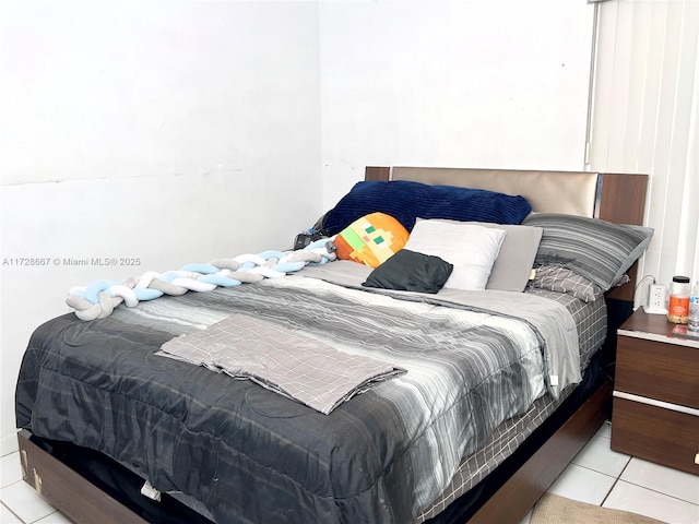 bedroom featuring light tile patterned floors