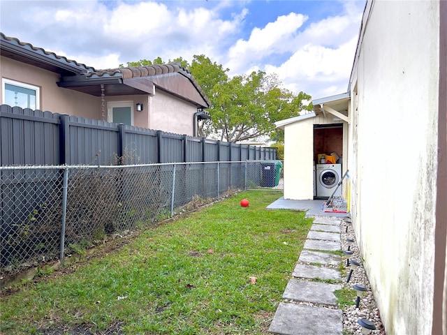 view of yard featuring washer / dryer